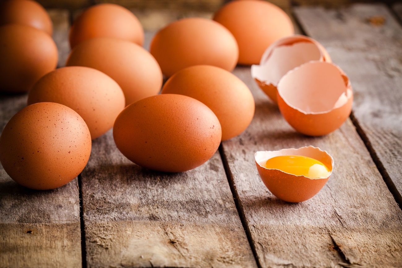 34131527 - fresh farm eggs on a wooden rustic background