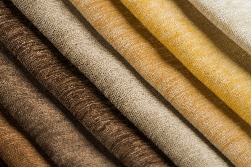 Closeup detail of multi color fabric texture samples.